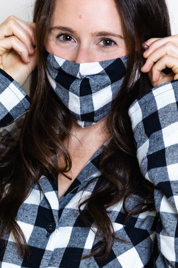 model wearing buffalo check face mask