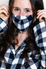 model wearing buffalo check face mask